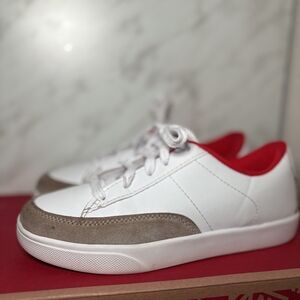 White and Tan Sneakers with Red Accents